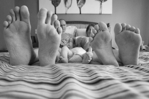 Mum, dad and new born baby's feet in comparison ©Erika's Way Photography 